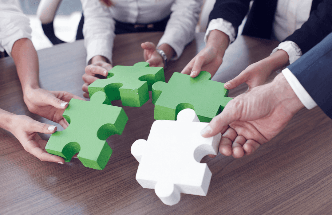 Group business people assebling jigsaw